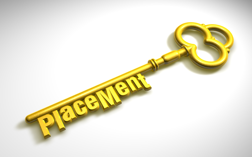 Gold key with the word 'placement' incorporated